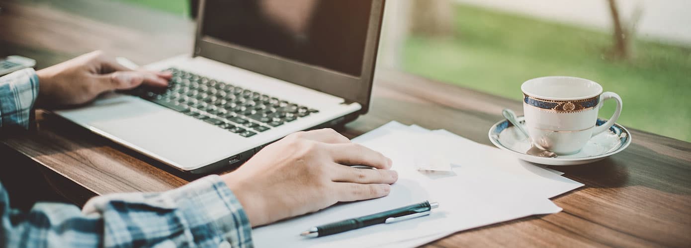 Person using laptop on desk